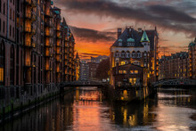 High Dynamic And Detailed Photography Of The Illuminated Speicherstadt With The Wasserschloss In Hamburg At Sunset