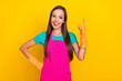 © deagreez - Photo of genius smart lady raise finger excellent idea concept wear latex gloves pink apron isolated yellow color background