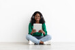 © Prostock-studio - Cheerful african american woman with wireless headset and digital tablet