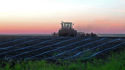 Wall Mural - agricultural automation and technologies. field cultivation with a tractor, data collection and analysis using artificial intelligence.