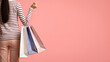 © Prostock-studio - Shopping Concept. Rear View Of Young Female Holding Shopper Bags, Cropped Shot