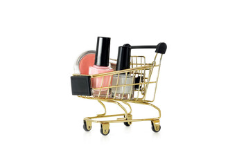 Wall Mural - Shopping trolley full of make up and cosmetic goods, isolated on white background. Black friday concept. Sale and discount. Goods for women. Closeup of a basket with products for make-up.