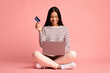 © Prostock-studio - Online Shopping. Beautiful Young Asian Woman Using Laptop And Credit Card