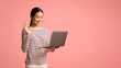 © Prostock-studio - Cheerful asian woman making video call with laptop, waving hand at camera