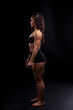© vadim_fl - Portrait of beautiful athletic woman with long curly black hair. Bodybuilding