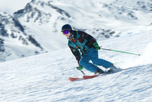A Young Man Ski On The Snow Mountain