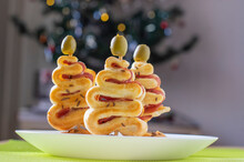 Salty Puff Pastry Bakery With Cheese, Ham And Green Olives On The Top, Group Of Christmas Tree Shapes