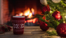 Hot Chocolate Cup, Burning Fireplace Background. Christmas Tree Decoration, Relaxation By The Fire