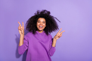 Poster - Photo of satisfied candid lady two hands make v-sign hello greetings symbol isolated on purple color background