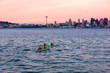Kayaking in the Puget Sound with Seattle skyline at sunset