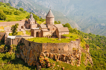 Wall Mural - Majestic Tatev Monastery located on an inaccessible basalt rock with wonderful views of the Vorotan River gorge. Travel and worship attractions in Armenia