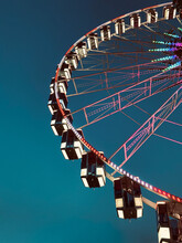 Low Angle View Of Ferris Wheel Against Clear Blue Sky