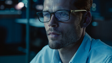 Poster - At Night Portrait of Handsome Startup Digital Entrepreneur Working on Computer, Line of Code Reflecting in Glasses. Developer Working on Innovative e-Commerce App using AI Algorithm Big Data. Blue
