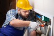 Man plumber working in the bathroom, plumbing repair service, assemble and install concept.