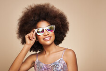 Beauty Portrait Of African American Girl In Colored Holographic Sunglasses. Beautiful Black Woman On Pink Background. Cosmetics, Makeup And Fashion