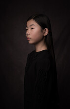 Classic Painterly Studio Portrait Of A  Young Asian Woman  In Black