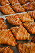 © Kirill - Freshly baked golden French croissants on baking sheet. Fresh classic pastries. Close up . High quality photo