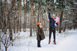 © irissca - Outdoor family activities for happy winter holidays. Happy father and mother playing with little baby toddler girl daughter in winter park, forest. Happy family on winter weekend, Christmas holidays