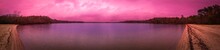 Panoramic Pink Sunset Vista Over Mashpee Pond On Cape Cod, Massachusetts In November. Tranquil Inspiring Twilight Seascape In Autumn Lake With Stormy Clouds Passing Over The Dark Forest. Sublime Color