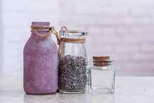 Dry Lavender Herbs In Beautiful Glass Jars, Glass Jars With Herbs On The Beige Backgroun