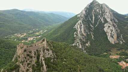 Wall Mural - Aerial shot showing the Medieval Puilaurens castle and the Canigou mount in the Pyrénées mountain, France