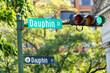 Mobile, USA with Dauphin street road sign closeup of old town in Alabama famous southern town city historic district with stoplight traffic green light