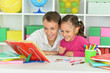 © aletia2011 - Porait of brother and sister doing homework together