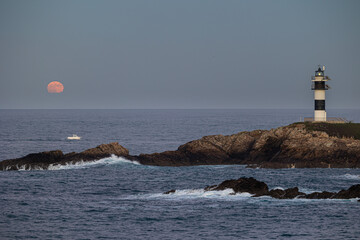 Wall Mural - November Full Moon over the Illa Pancha lighthouse and hotel, in Ribadeo, Galicia, Spain!