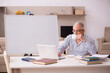 © Elnur - Old male employee working from home during pandemic