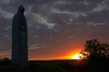 Wall Mural - Monument to Sergii Radonezhsky in historic village Radonezh at sunset,  Radonezh village, Sergiyev Posad district,  Moscow region,  Russia 