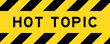 Yellow and black color with line striped label banner with word hot topic