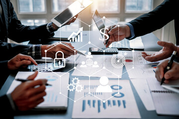 Business team working together planning investment at meeting. Close up view of business people advisors pointing at graph and analyzing financial report.