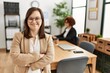 © Krakenimages.com - Down syndrome girl working at inclusive teamwork. Group of two women working at the office