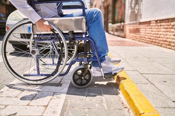 Sticker - Middle age hispanic man wearing business clothes sitting on wheelchair at street