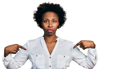 Sticker - African american woman with afro hair pointing with fingers to herself relaxed with serious expression on face. simple and natural looking at the camera.