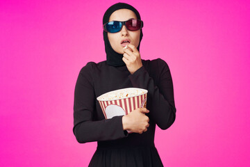 Wall Mural - arab woman entertainment cinema popcorn fashion purple background