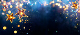Fototapeta Na sufit - Christmas Stars Lights - Golden String Hanging In Blue Background With Abstract Defocused Bokeh