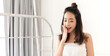© Art_Photo - Portrait of smiling cheerful beautiful pretty asian woman clean fresh healthy white skin posing in pajamas white clothes.Girl felling relaxing and enjoy time on the bed at home.asia beauty