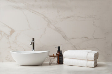 Washbasin , foreground of the counter top washbasin , Interior of a modern bathroom with a wall , Modern bathroom interior , White bathroom sink , white bathroom interior with washbasin and plant.