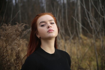 Wall Mural - Closeup portrait of a young girl with red hair in forest pretty woman cute one person portrait beauty smile lifestyle