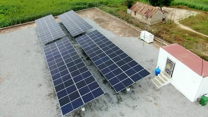 an aerial view of solar panels in the nigerian countryside for alternative, renewable power