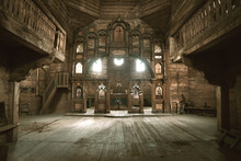 Interior Of An Old Abandoned Church Somewhere In Eastern Europe. Wooden Altar And Iconostasis In Melancholic Ruination. 