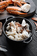 Mixed brown white crabmeat boiled set, on black wooden table background