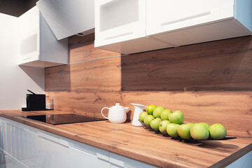 Poster - Kitchen interior, modern kitchen with many apples on a platter, breakfast concept, kitchen background, concept of healthy eating, interior of modern kitchen
