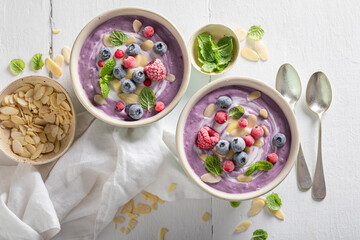 Wall Mural - Homemade cream cold soup with frozen berries and mint.