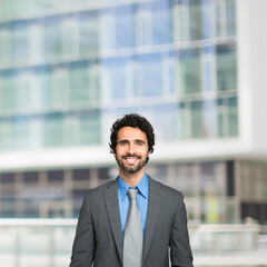 Wall Mural - Smiling business man, businessman with large copy-space