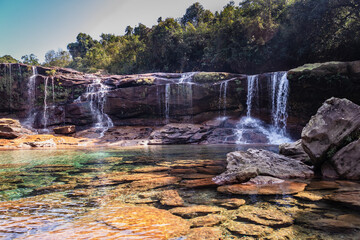 natural waterfall white water streams with calm clear water at morning