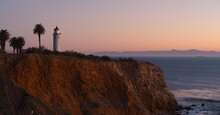 This Image Shows The Point Vicente Lighthouse In Rancho Palos Verdes At Dusk. The Santa Catalina Island Is Shown In The Background.
