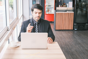 business caucasian man sitting in working in co working space