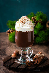 Wall Mural - Hot milk chocolate with whipped cream. Winter and autumn warming drink. Copy space